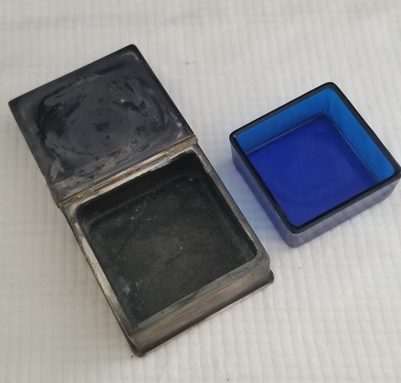 Open box qith blue glass insert